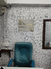 Dr. Faraah's consultation chair with the clinic nameplate in the background